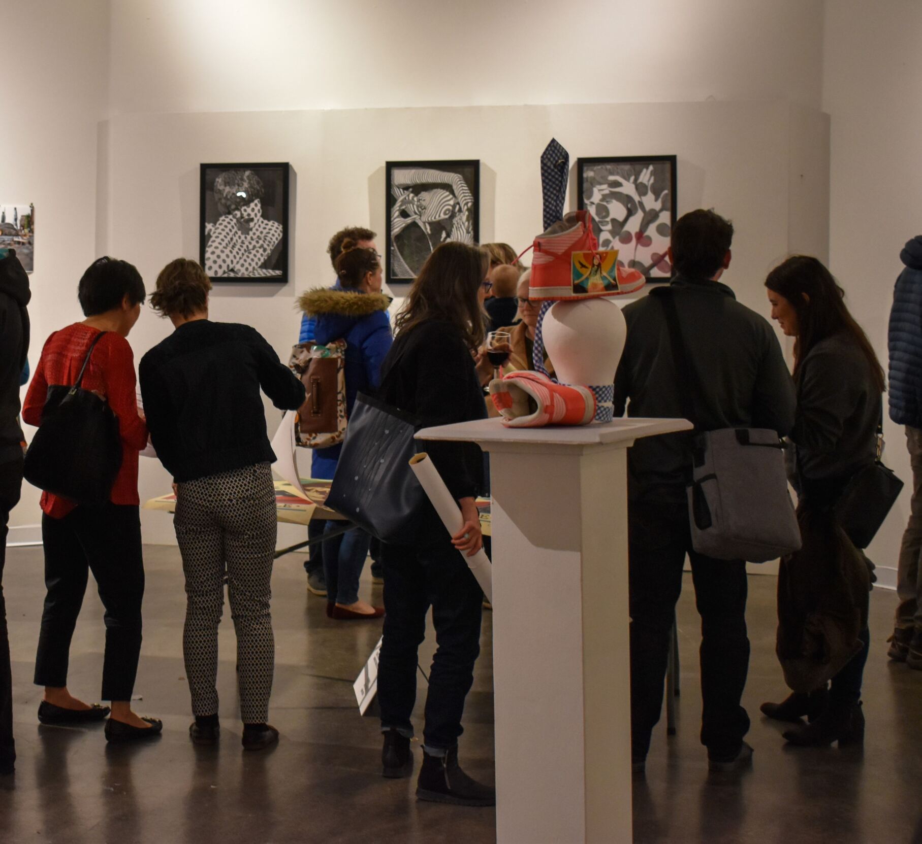 People Enjoying Art at a Gallery