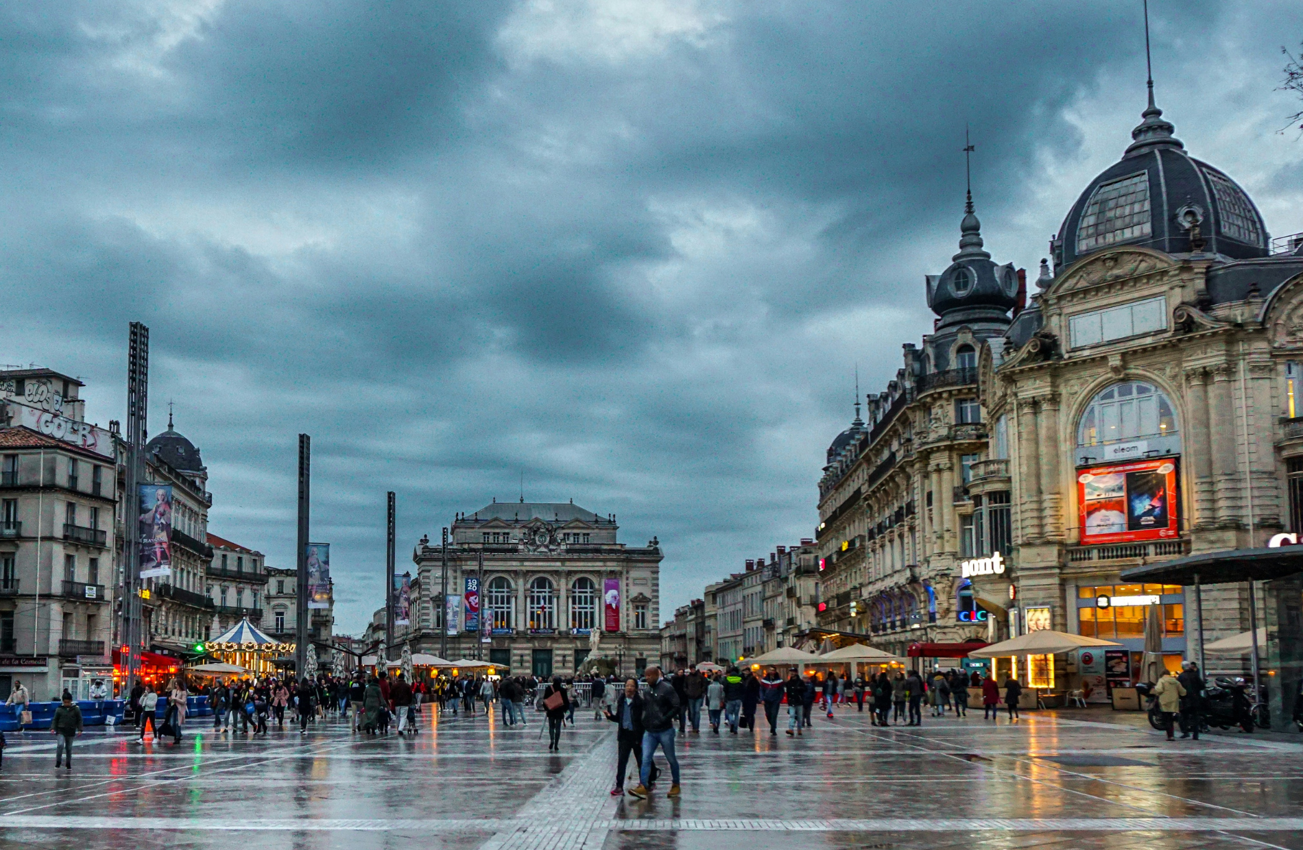 people walking on pedestrian walkway on a rainy day