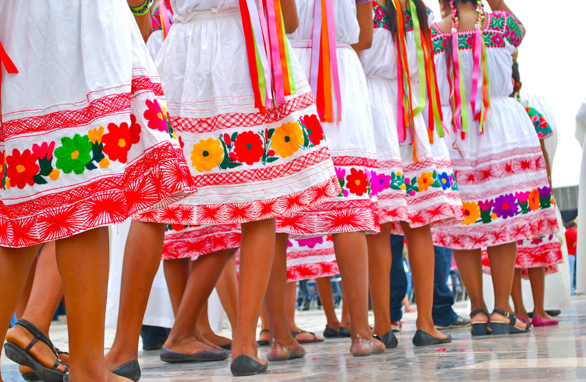 colorful floral skirts of traditional Mexican dancers