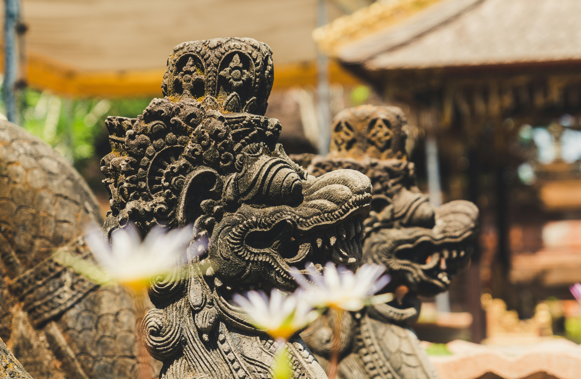 two decorative lion sculptures at an Indonesian temple