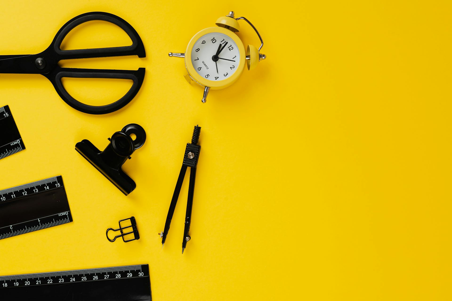 Stationery items on yellow background