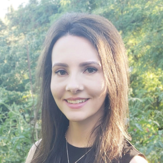 Arryn Prescott in front of foliage