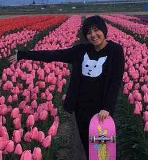 Photo of Maya Lall in field of pink tulips