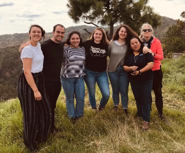 Photo of Serena Cosgrove and students in Guatemala