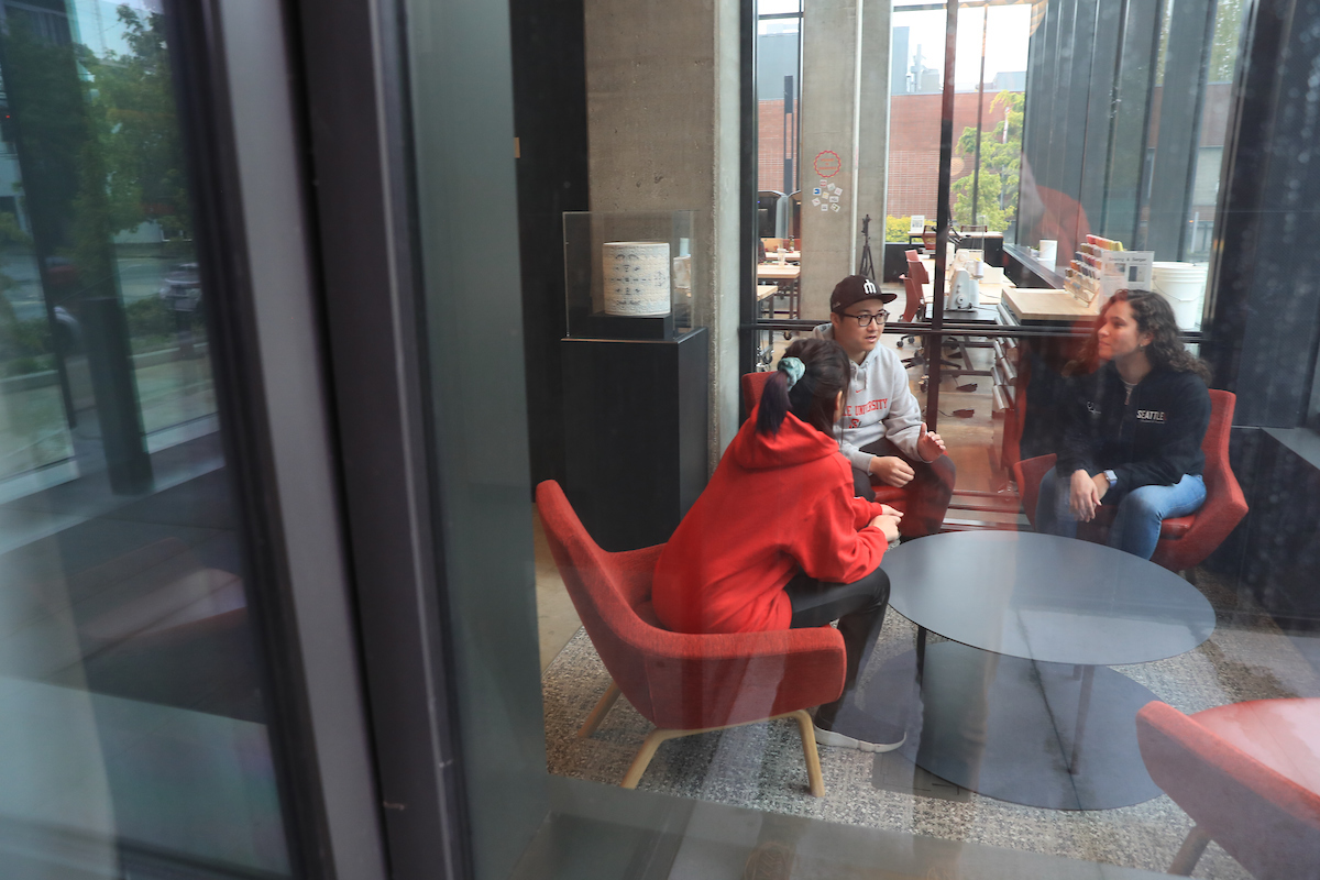 Students sitting around a table talking