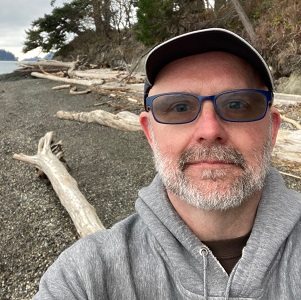 Photo of Marc McLeod on rocky beach