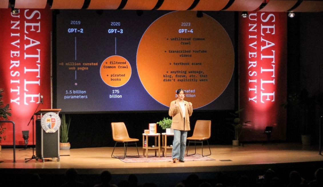 Empire of AI on stage speaking