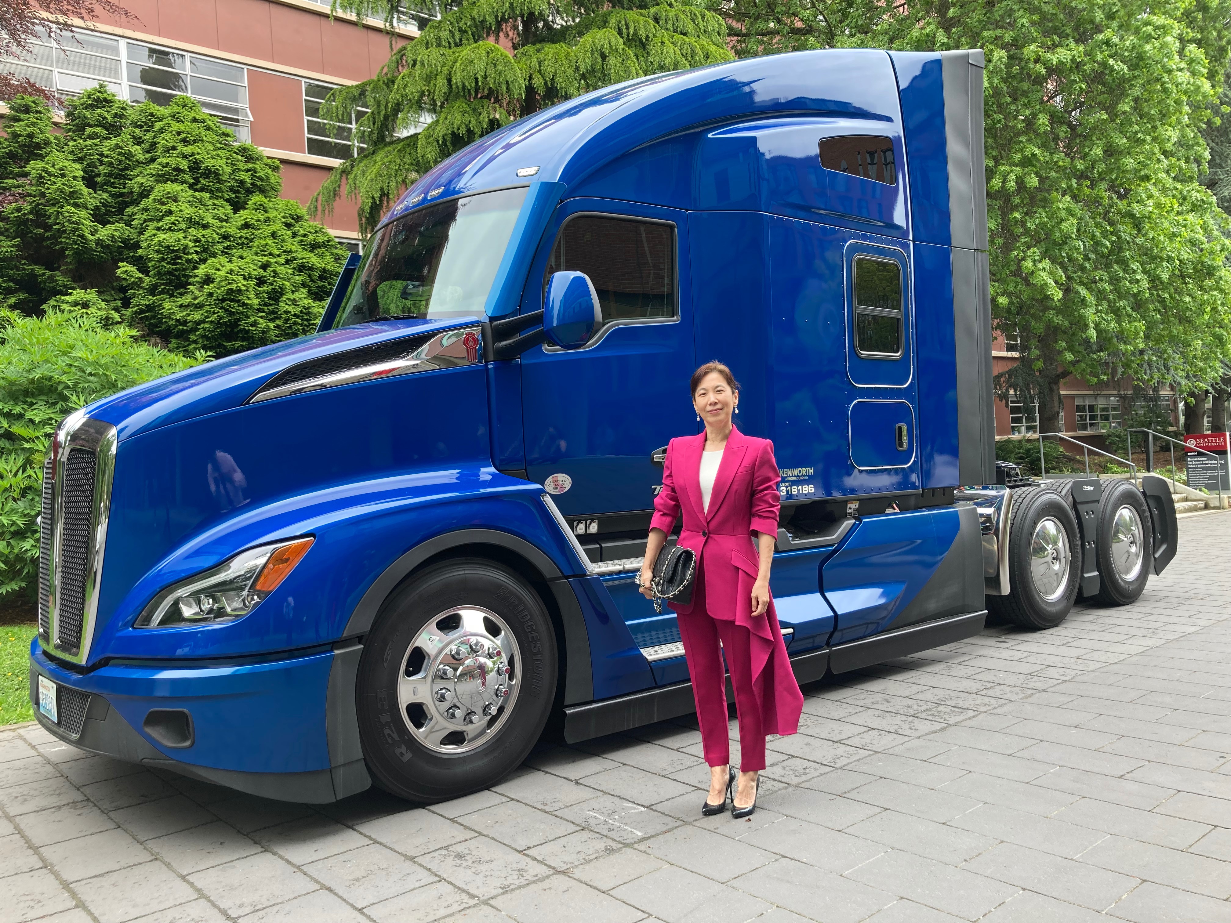 Yen-Lin poses in front of a Kenworth truck