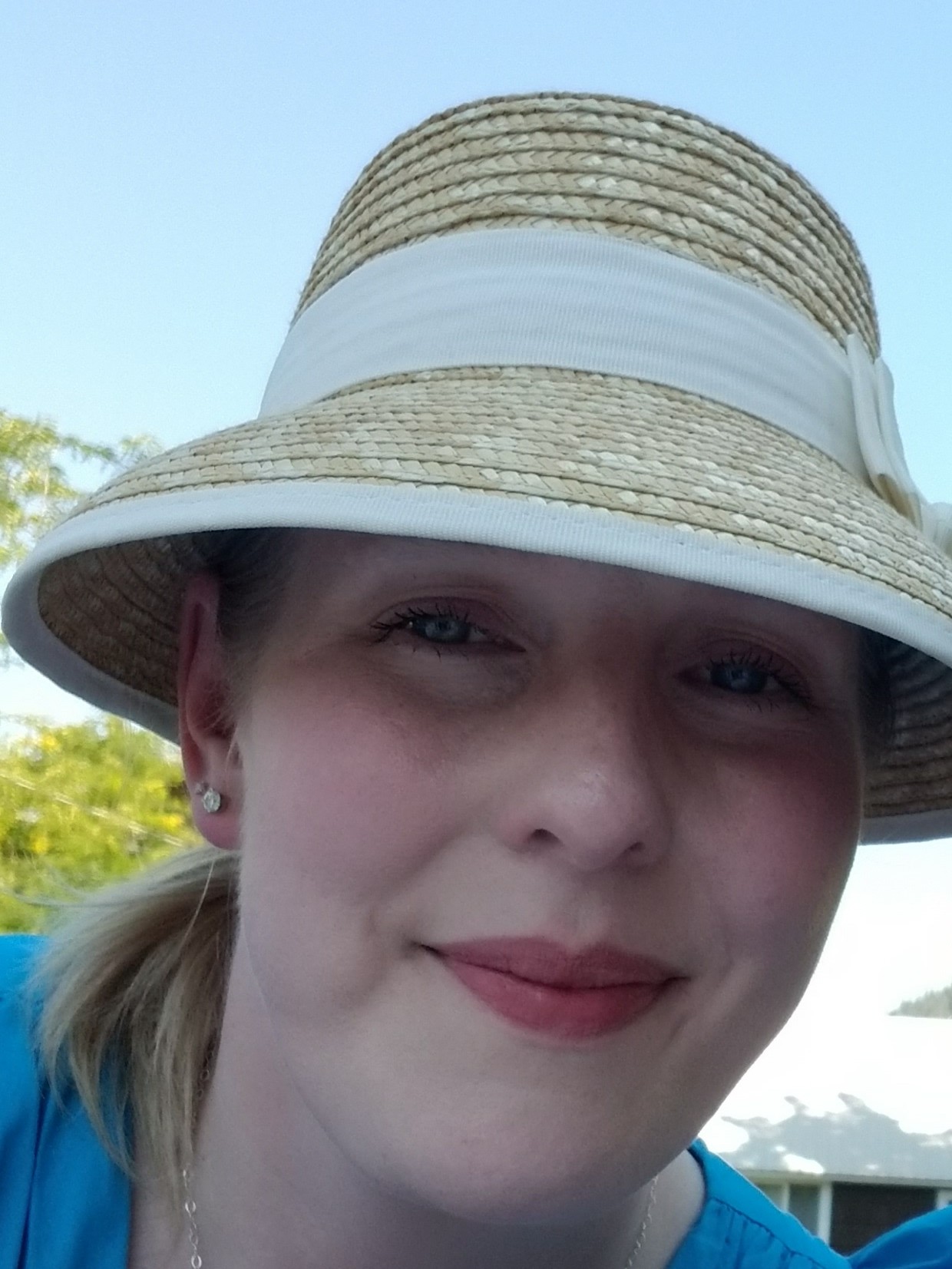 Photo of Amy O'Brien wearing a hat