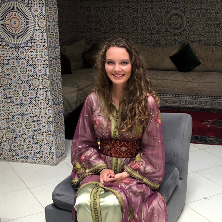 celia sitting in a chair in morocco