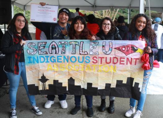 A group of 6 people holding a sign that says Indigenous student club
