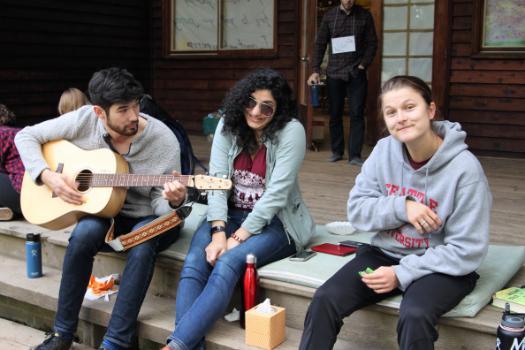 Photo of students at Search Retreat playing guitar