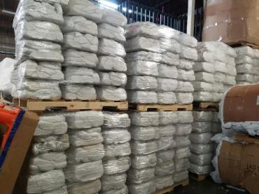 Stacks of condensed foam products stacked on pallets.