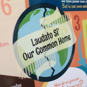 Image of a globe reading Laudato Si Our Common Home