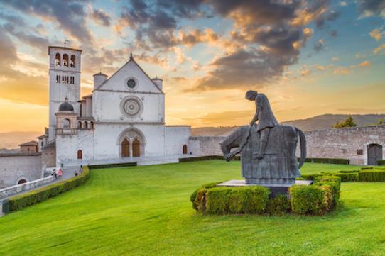 a shutterstock photo of a statue of St Francis on a horse in front of a church