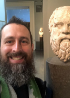 Image of Dominic Yancy and bust of Socrates