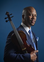 Photo of Dr. Quinton Morris with violin