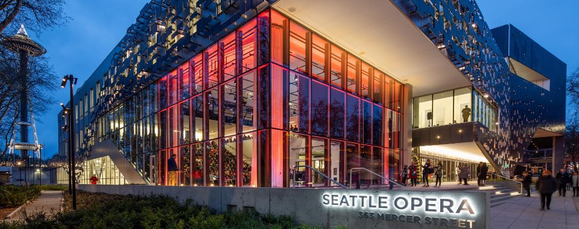 Photo of Seattle Opera building with red lighting