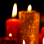 Red and gold candles on black background