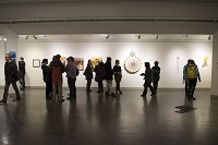 A crowd of people viewing the Vachon Gallery