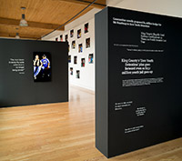 Image of exhibition of video, text, photography and sculpture by Creative Justice, installed at Hedreen Gallery