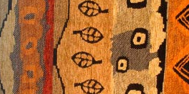 Image of African fabric in reds, browns, and oranges