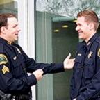 Two officers talking.