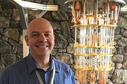 Brian Eccles of IBM standing in front of the Quantum Computer