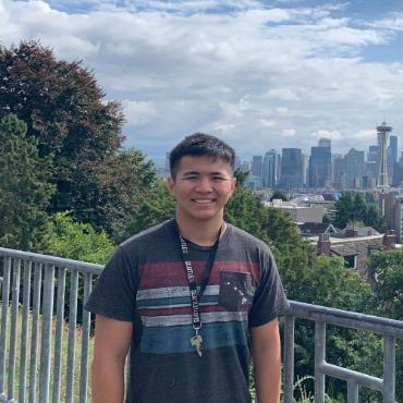Cameron Ching with Seattle skyline and Space Needle