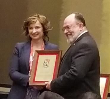 Agnieszka Miguel receiving HKN Chapter award at the ECEDHA Conference 