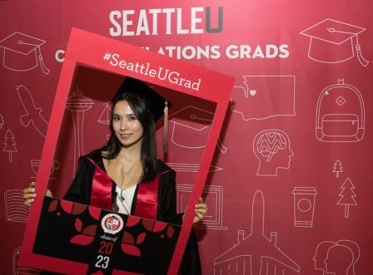 A commencement picture with graduate inside photo booth