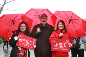 Father Steve at the Homecoming Red Umbrella Parade 