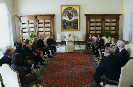 Father Steve with a group meeting and speaking with Pope Francis 