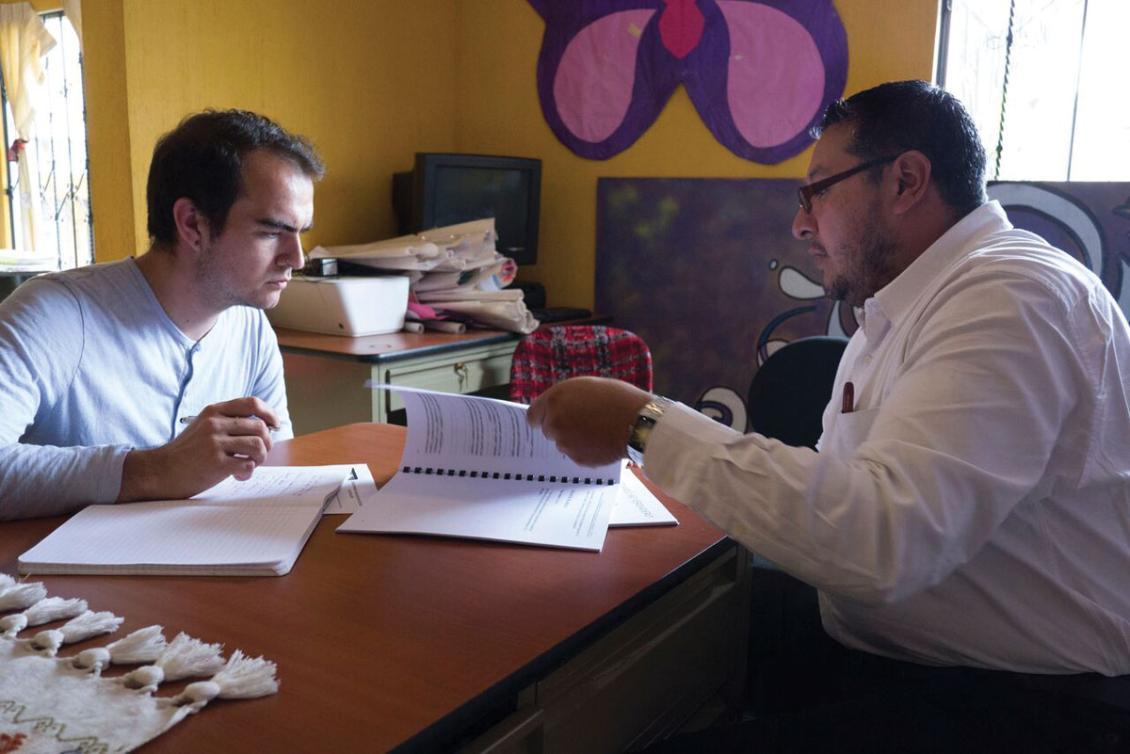 Michael Lott, '16 (left) meets with a project colleague while conducting research in Guatemala.