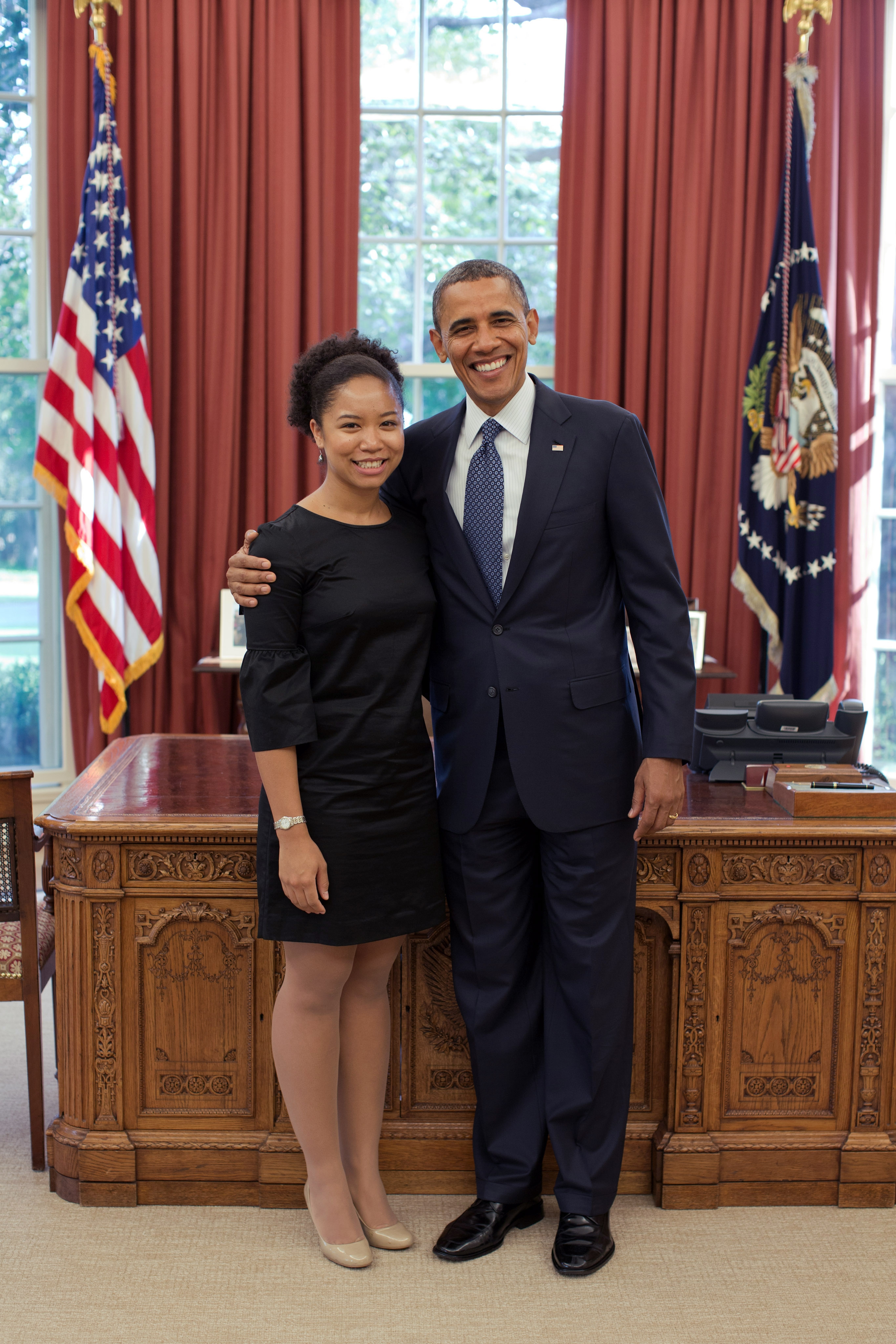 Student, Aerica Banks, recipient of Truman, PPIA, Udall, and (unknown) fellowships pictured with former United States president, Barack Obama, in the oval office