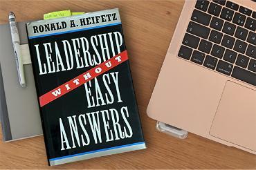 Leadership Without Easy Answers Book on Desk with Computer 