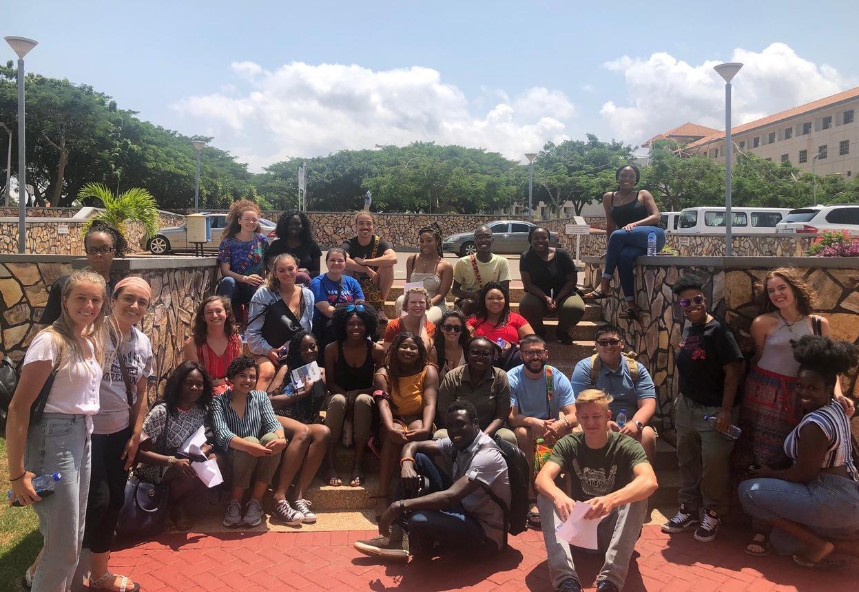 A group of students sitting on stairs in Ghana