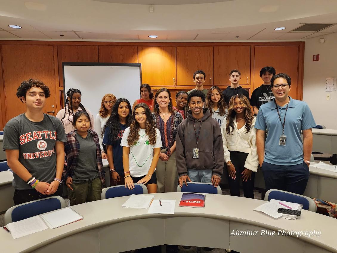 A group of students with their faculty in a classroom