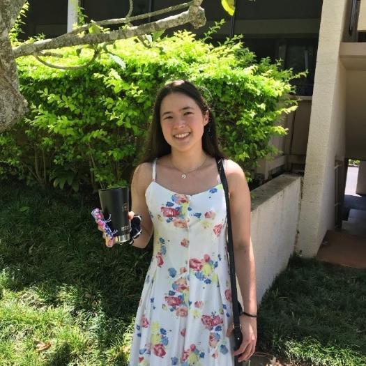 Photo of Elena Pendleton in front of greenery