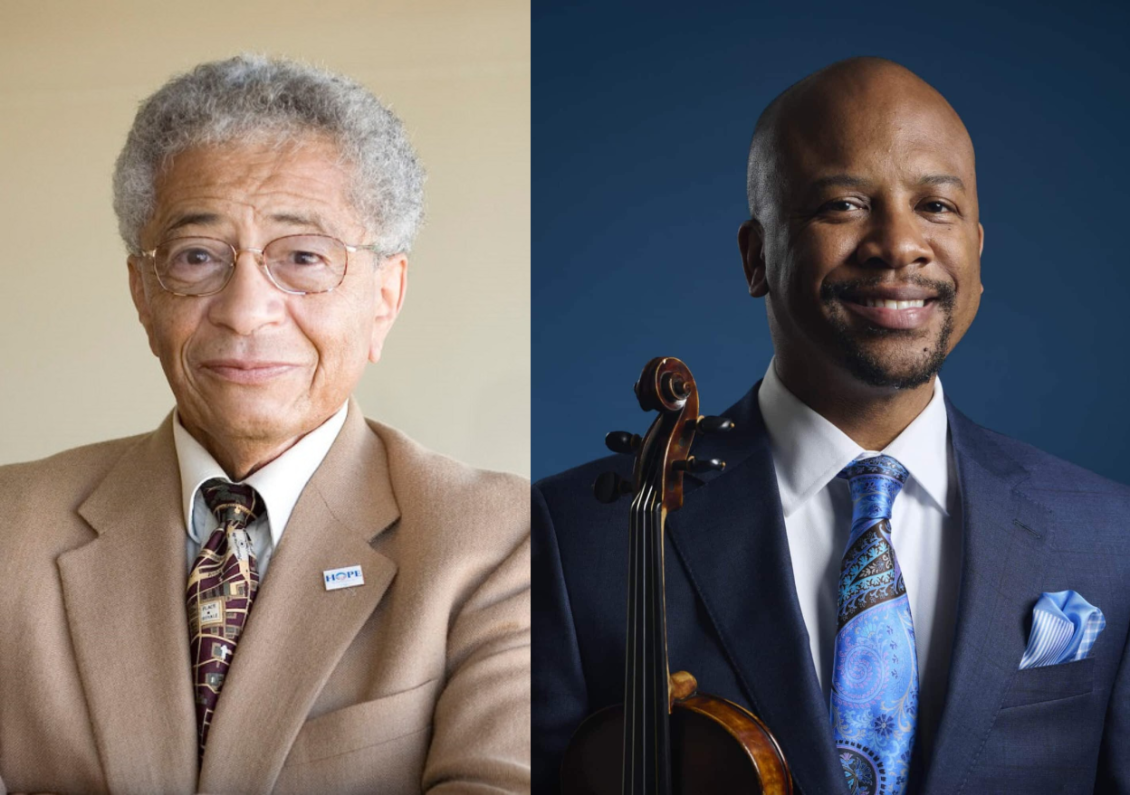 two men side by side one holding a violin