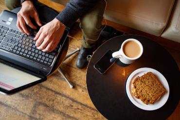coffee and a laptop and a person