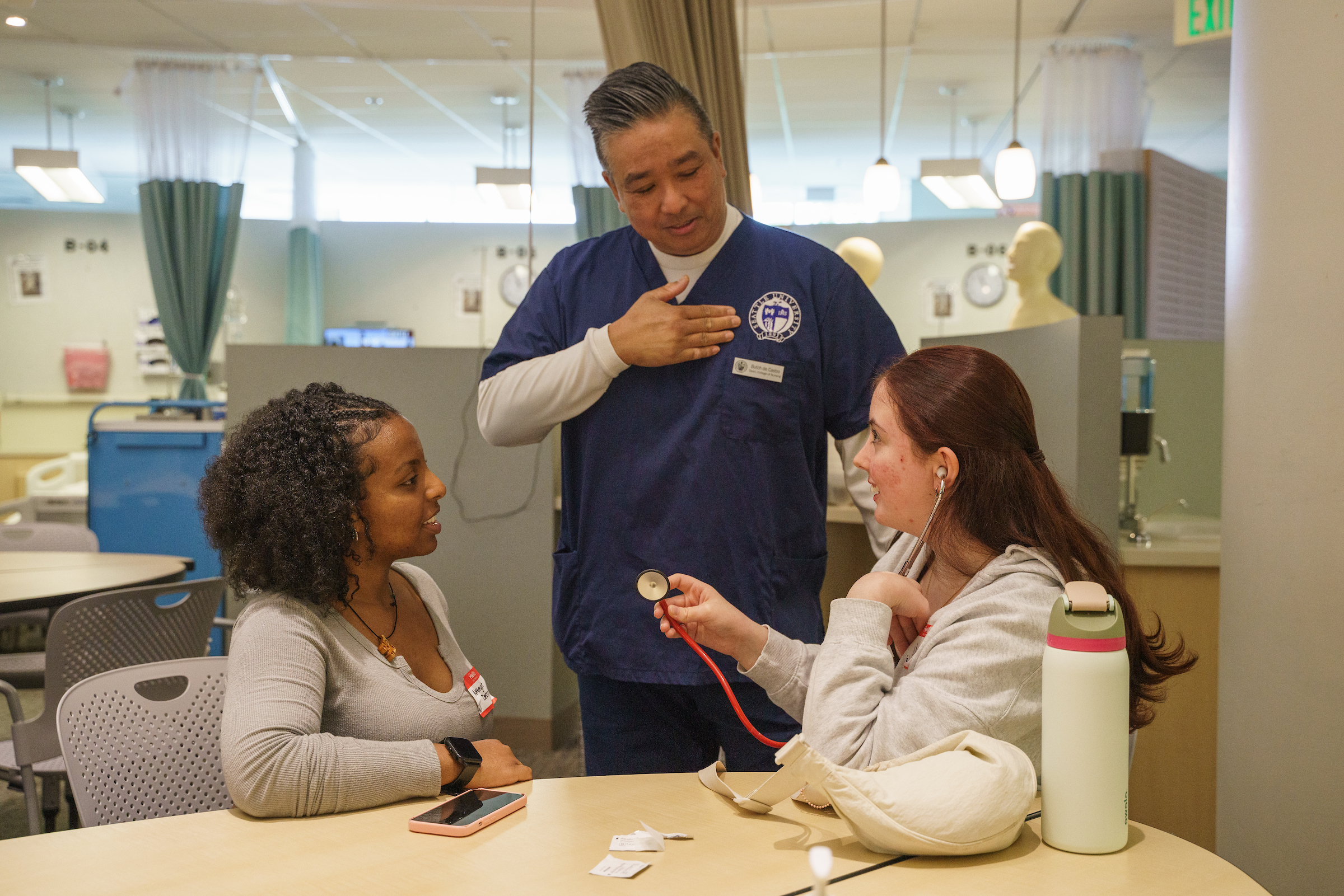 Dean Butch de Castro with two undergraduate students