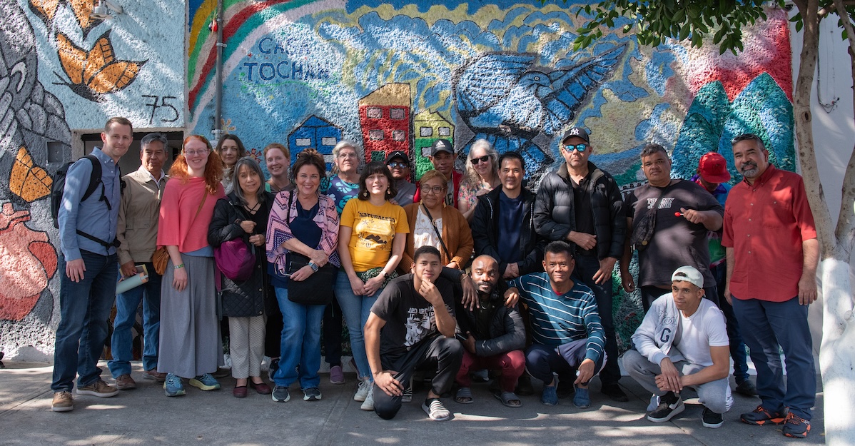 Mexico immersion trip participants against wall
