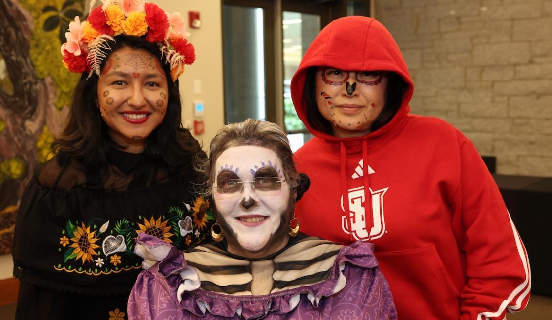 Group shot of three in Halloween costumes