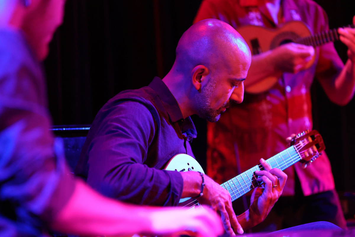 Onur Bakiner playing music with a band