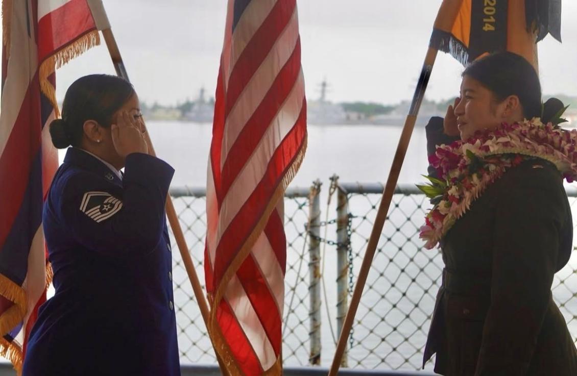 Cadet w/ lei saluting officer