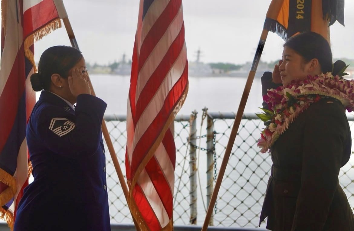 Cadet w/ lei saluting officer