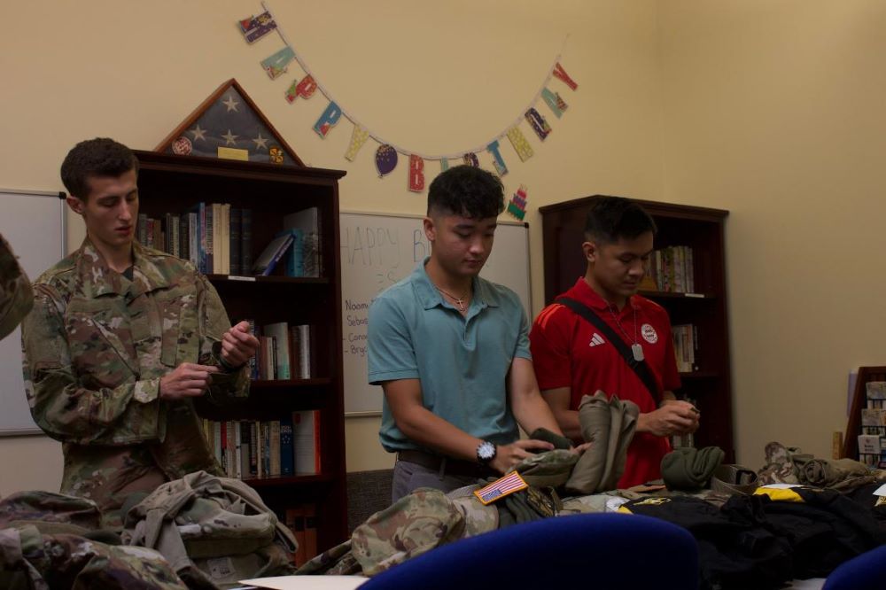 Student Cadet getting new gear on table