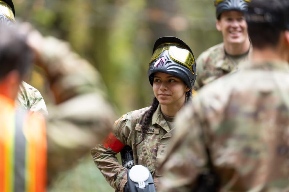 Cadet w/ goggles facing others outdoors