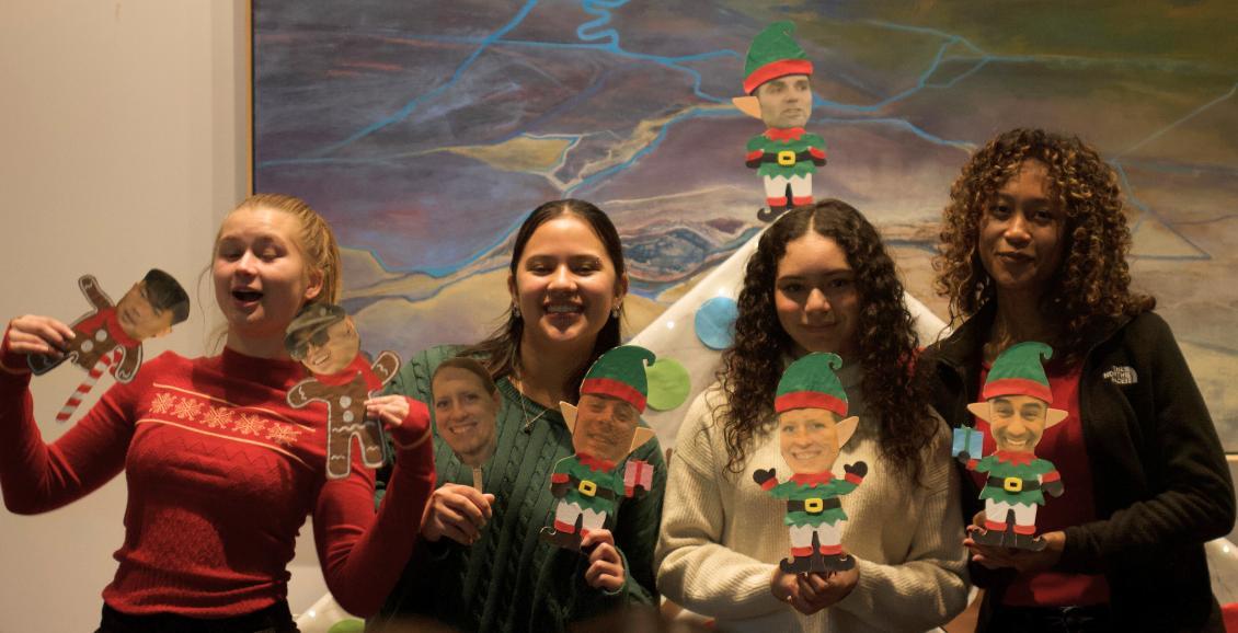 Cadets in front of gingerbread house